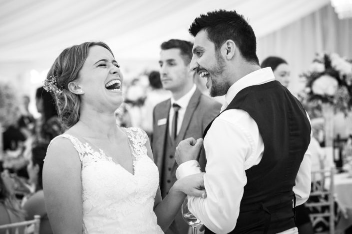 Black & White Candid image of Bride & wedding guests