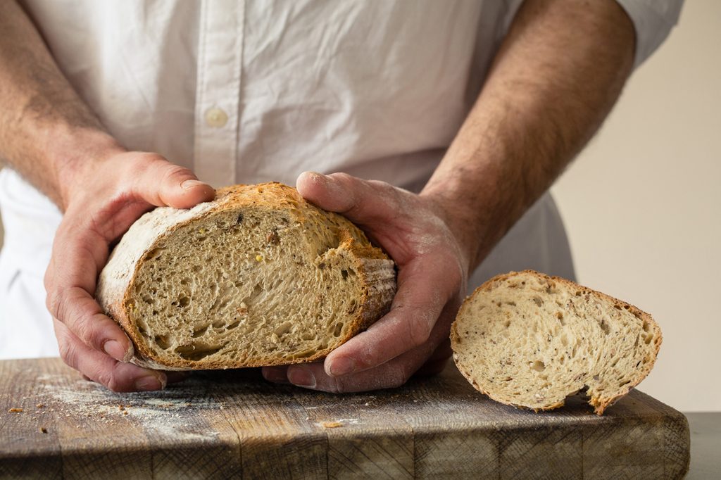 Baker holding bread, Hobbs House Bakery, Tom Herbert, Fabulous Baker Brothers