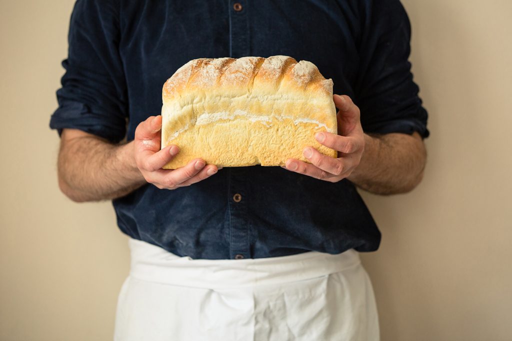 Baker holding loaf of bread, Hobbs House Bakery, Tom Herbert, Fabulous Baker Brothers