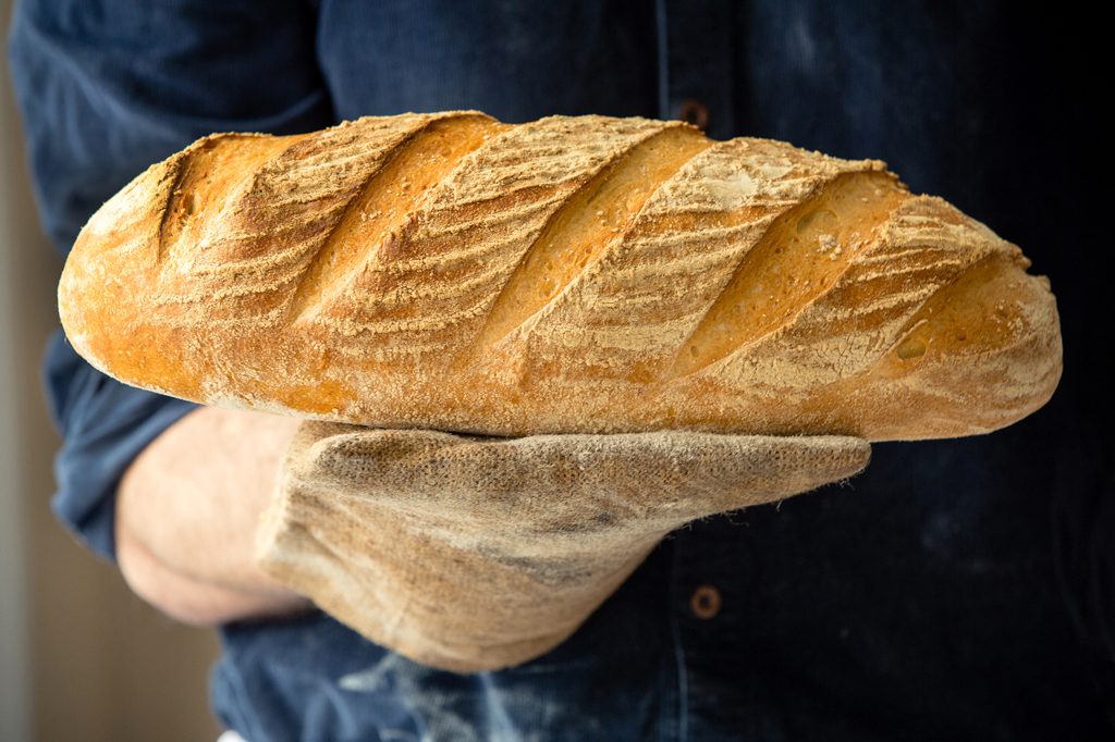 Baker holding loaf of bread, Hobbs House Bakery, Tom Herbert, Fabulous Baker Brothers