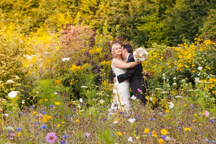 Couple kissing in walled garden