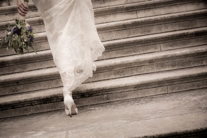 Image of Bride walking up steps